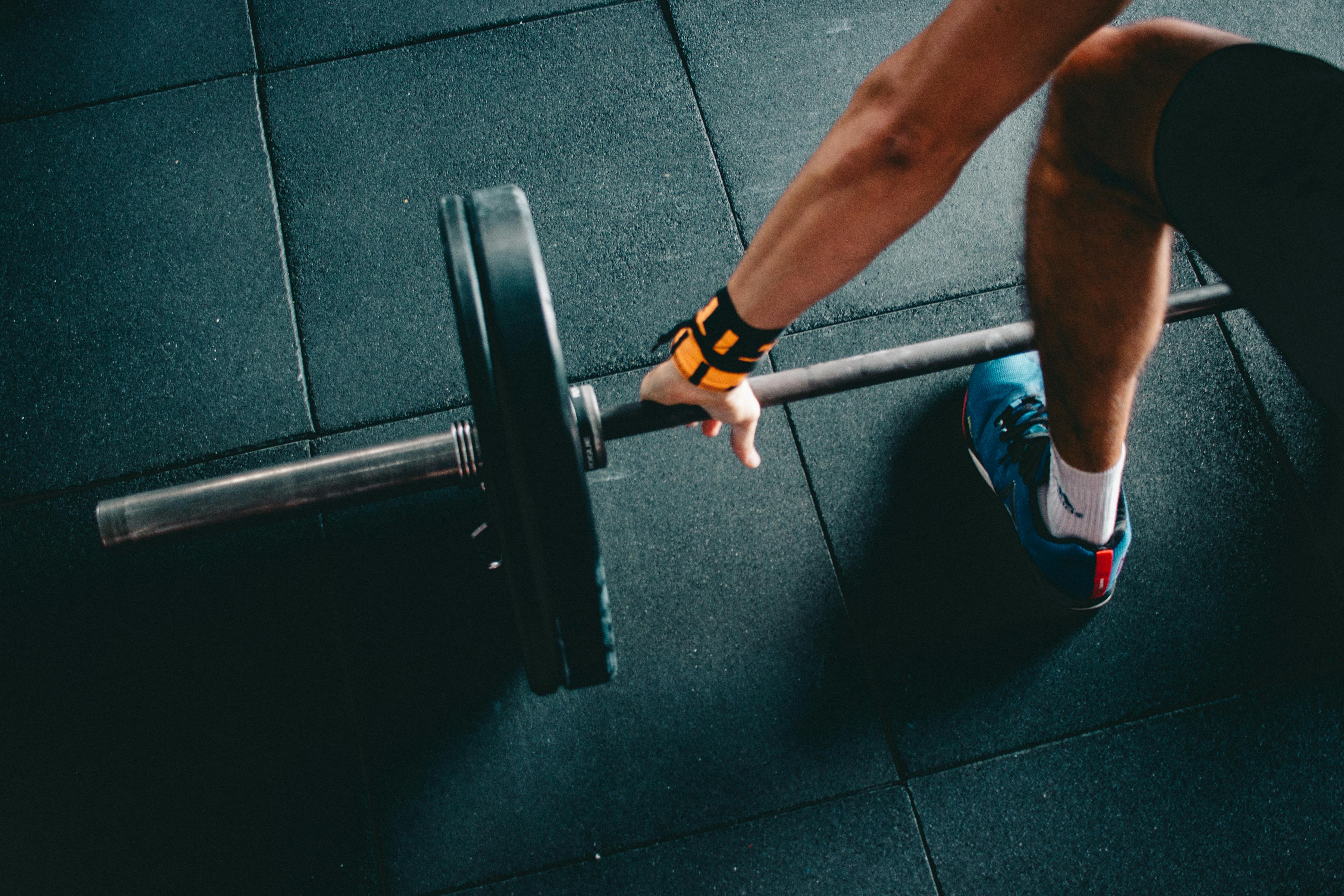 Athlete holding barbell at the gym
