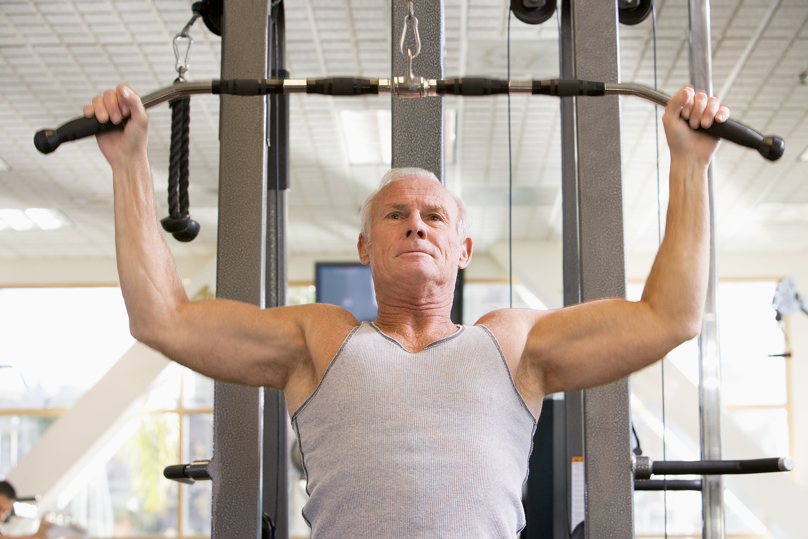 Older man training at the gym